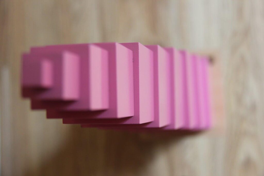a close up of pink tower toy – Mont Ivy Preschools