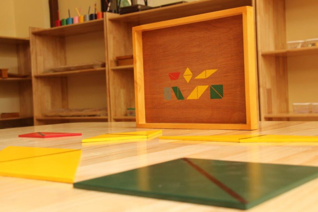 a picture frame sitting on top of a hard wood floor with constructive triangles – Mont Ivy Preschools